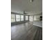Spacious living room with gray vinyl flooring and lots of natural light at 1023 S Hiawassee Rd # 4022, Orlando, FL 32835