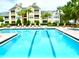 Refreshing community pool with apartment building view at 1023 S Hiawassee Rd # 4022, Orlando, FL 32835