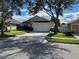 Residential home exterior view with a neatly kept lawn at 10887 Flycast Cir, Orlando, FL 32825