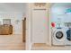 Bright laundry room with washer, dryer and extra storage at 113 Lena Ann Dr, Saint Cloud, FL 34771