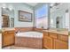 Bathroom with corner soaking tub and double vanity at 113 Secluded Oaks Ct, Casselberry, FL 32707