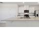 Kitchen island with quartz countertop and stainless steel sink at 148 Archer Ave, Lake Alfred, FL 33850