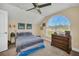 Bedroom with large window and wooden dresser at 17640 Las Brisas Ct, Winter Garden, FL 34787