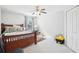 Spacious bedroom with a queen bed, ceiling fan, and window at 17835 Olive Oak Way, Orlando, FL 32820