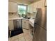 Clean and functional kitchen with white cabinets and stainless steel appliances at 199 N Hill Ave # 70, Deland, FL 32724