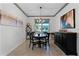 Bright dining room with a round table and black buffet at 2532 Civitas Pl, Casselberry, FL 32707