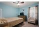 Relaxing bedroom with light blue walls and plenty of space at 261 S Wilderness Pt, Casselberry, FL 32707