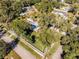 Aerial view of a house and large lot in a quiet neighborhood at 301 N Oak Ave, Orange City, FL 32763