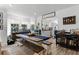 Farmhouse style dining room with large wooden table, benches, and kitchen views at 301 N Oak Ave, Orange City, FL 32763