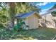 View of a detached storage shed in the backyard at 302 E Derby Ave, Auburndale, FL 33823