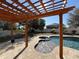 Inviting pool and spa area with a pergola for shade at 30325 Gidran Ter, Mount Dora, FL 32757