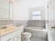 Bathroom with a bathtub, toilet, and vanity at 304 N Lakeview Dr, Longwood, FL 32750