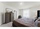 Spacious bedroom with large bed, dresser, and window at 3337 Private Oak Dr, Apopka, FL 32703