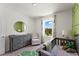 Bedroom featuring gray dresser and a comfy chair at 3337 Private Oak Dr, Apopka, FL 32703