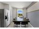 Kitchen dining area with a large window and modern table and chairs at 3337 Private Oak Dr, Apopka, FL 32703