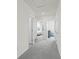 Upstairs hallway with carpet and doors to bedrooms at 3337 Private Oak Dr, Apopka, FL 32703