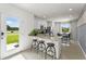 Open concept kitchen with breakfast bar and stainless steel appliances at 3337 Private Oak Dr, Apopka, FL 32703