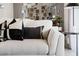 Living room featuring a neutral colored couch with black and white pillows at 3337 Private Oak Dr, Apopka, FL 32703
