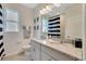 Bathroom with granite countertop and navy and white decor at 3528 Keyworth St, Apopka, FL 32712