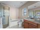 Bathroom includes a tub, shower, and vanity at 4000 Messina Dr, Lake Mary, FL 32746