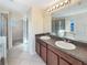 Double vanity bathroom with a large mirror and shower at 4718 Rockvale Dr, Kissimmee, FL 34758