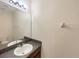 Simple bathroom with a vanity, mirror, and toilet at 4718 Rockvale Dr, Kissimmee, FL 34758