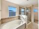Bathroom with garden tub and walk-in shower at 4718 Rockvale Dr, Kissimmee, FL 34758