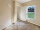 Bright bedroom featuring a window and door at 4718 Rockvale Dr, Kissimmee, FL 34758