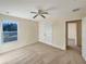 Spacious bedroom with ceiling fan and large window at 4718 Rockvale Dr, Kissimmee, FL 34758