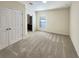 Well-lit bedroom with double doors and en-suite bathroom at 4718 Rockvale Dr, Kissimmee, FL 34758