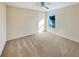 Spacious bedroom with neutral colored carpet and ample natural light at 4718 Rockvale Dr, Kissimmee, FL 34758