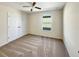 Bright bedroom with double doors and ceiling fan at 4718 Rockvale Dr, Kissimmee, FL 34758