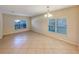 Bright dining room with tile floors and a window providing natural light at 4718 Rockvale Dr, Kissimmee, FL 34758