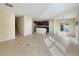Living area with tile floors, stairs, and kitchen views at 4718 Rockvale Dr, Kissimmee, FL 34758