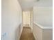 Upstairs hallway with carpeted floors and neutral walls at 4718 Rockvale Dr, Kissimmee, FL 34758