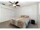 Well-lit bedroom with carpeted floors and built-in closet at 4970 Turnbull Dr, Orlando, FL 32812