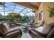 Covered patio with wicker furniture and a view of the pool at 6167 Hedgesparrows Ln, Sanford, FL 32771