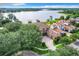 Luxury home on the lake with a large lot and beautiful landscaping at 6245 Little Lake Sawyer Dr, Windermere, FL 34786