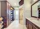 Large bathroom with double vanity, walk-in shower, and linen closet at 6245 Little Lake Sawyer Dr, Windermere, FL 34786