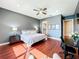 Spacious bedroom with wood floors, walk-in closet, and plenty of natural light at 6245 Little Lake Sawyer Dr, Windermere, FL 34786