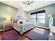 Charming bedroom with a canopy bed and lake views at 6245 Little Lake Sawyer Dr, Windermere, FL 34786