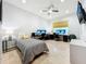 Bright bedroom with tile floors, built-in workspace and a bed at 6245 Little Lake Sawyer Dr, Windermere, FL 34786