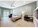 Spacious bedroom with tile floors, a bed, and an office area at 6245 Little Lake Sawyer Dr, Windermere, FL 34786