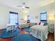 Charming bedroom with twin beds, ample natural light, and colorful decor at 6245 Little Lake Sawyer Dr, Windermere, FL 34786