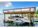 Covered boat dock with lift for jet skis and boat at 6245 Little Lake Sawyer Dr, Windermere, FL 34786