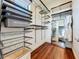 Large walk-in closet with custom shelving and ample storage space at 6245 Little Lake Sawyer Dr, Windermere, FL 34786