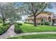 Charming gazebo nestled amongst lush greenery, offering waterfront views at 6245 Little Lake Sawyer Dr, Windermere, FL 34786