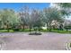 Circular brick-paved neighborhood entrance with lush landscaping and streetlights at 6245 Little Lake Sawyer Dr, Windermere, FL 34786