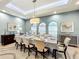 Formal dining room with large table, neutral decor, and plenty of natural light at 6245 Little Lake Sawyer Dr, Windermere, FL 34786