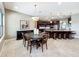 Kitchen and dining area with granite island and seating at 6245 Little Lake Sawyer Dr, Windermere, FL 34786